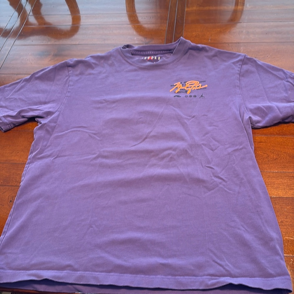 Purple Nike Air Jordan tee shirt.